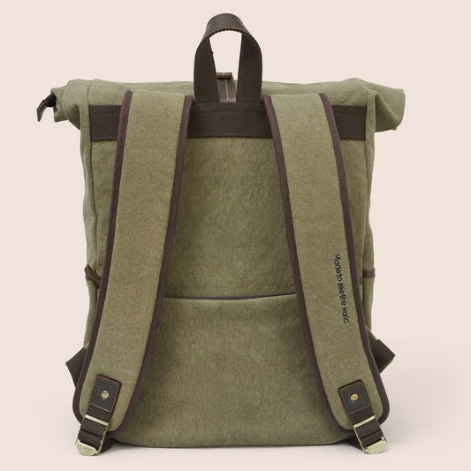 Gandys green roll-top backpack with brown straps on a beige background