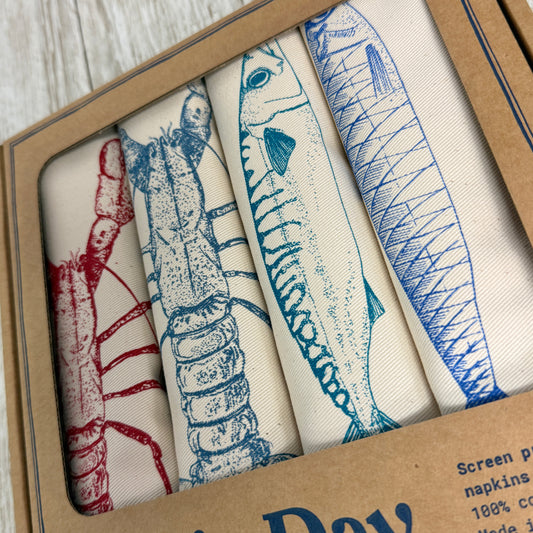 4 screen printed Napkins - original illustrations of blue lobster, red lobster, mackerel and Sardine, these handmade accessories are an original idea for seafood lovers or a quirky present for a friend who has everything.