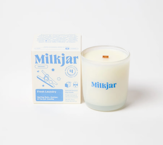 Milkjar Fresh Laundry candle and packaging, blue and white design on a white background wooden crackle wick. Plant-based coconut soy wax 40–45 hour burn time with proper wick trimming Vegan and cruelty-free