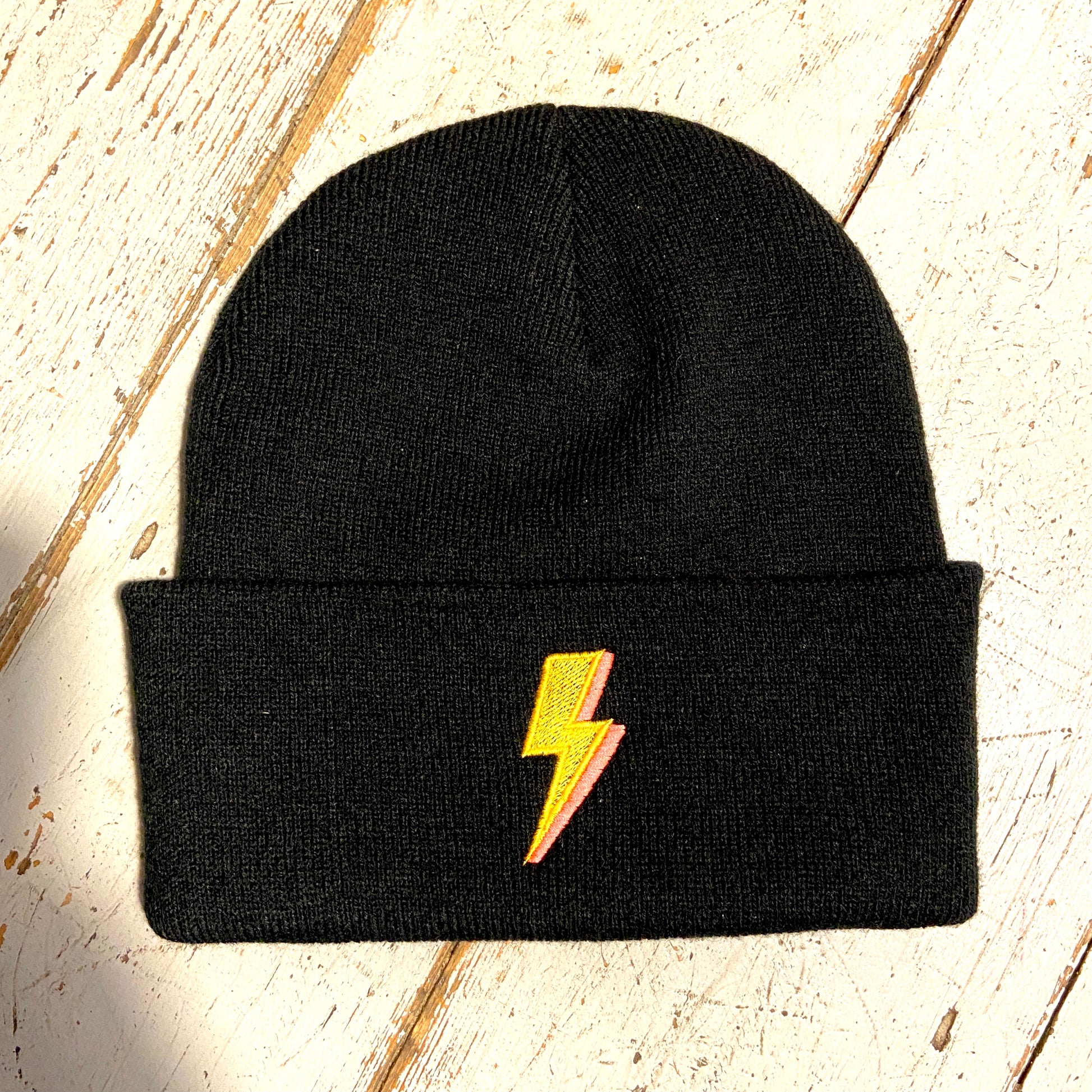 Embroidered to match our ever popular lighting bolt design.  Available in Teal or black  Beanies are made from 100% soft-touch acrylic in a double layer knit. One size fits all. Glitter & Mud