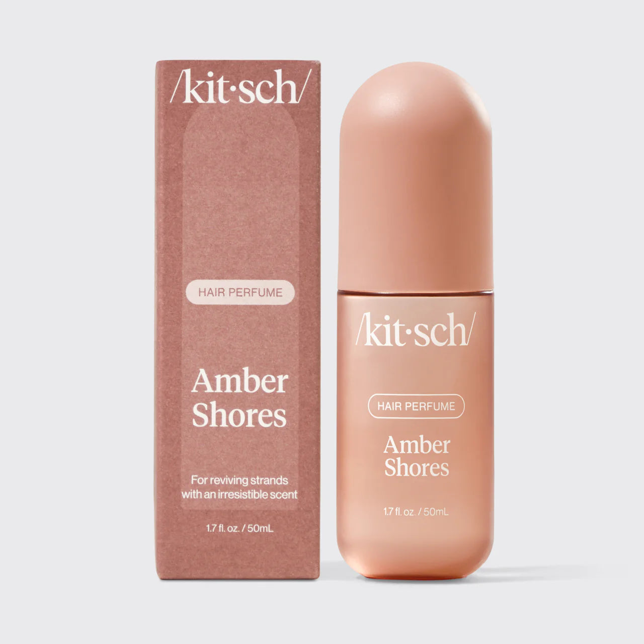 Kit-sch Amber Shores hair perfume bottle and packaging on a light gray background