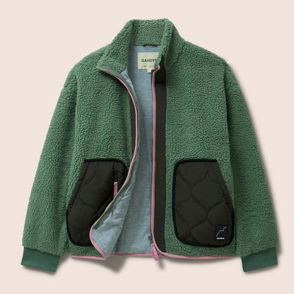 Gandys Green fleece jacket with quilted black pockets on a beige background