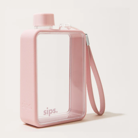 A pink rectangular travel tumbler with a clear front window, matching pink lid, and an attached pink wrist strap, photographed on a clean off-white background.