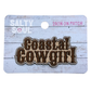 Embroidered Iron on patch with western style 'Coastal Cowgirl' text on a wooden textured card, brand 'Salty Soul' visible.
