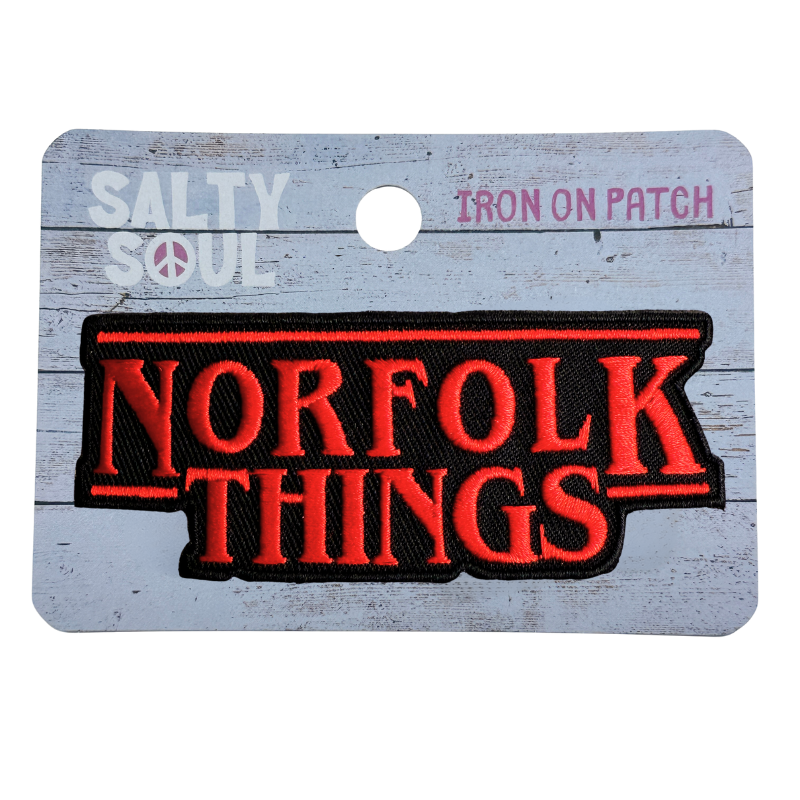 Embroidered Iron on patch with 'Norfolk Things' text on a wooden tag, brand 'Salty Soul' visible.