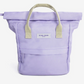 A lavender purple canvas backpack with light beige handles and a white brand label reading 'KIND BAG LONDON' on the front, shown against a plain white background.