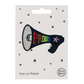 Iron on patch megaphone design and 'PROUD' in rainbow colours text on a white card with star patterns with 'petra boase branding 