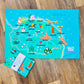 Colourful map of North Norfolk coast on a wooden surface with 'Salty Soul' branding.