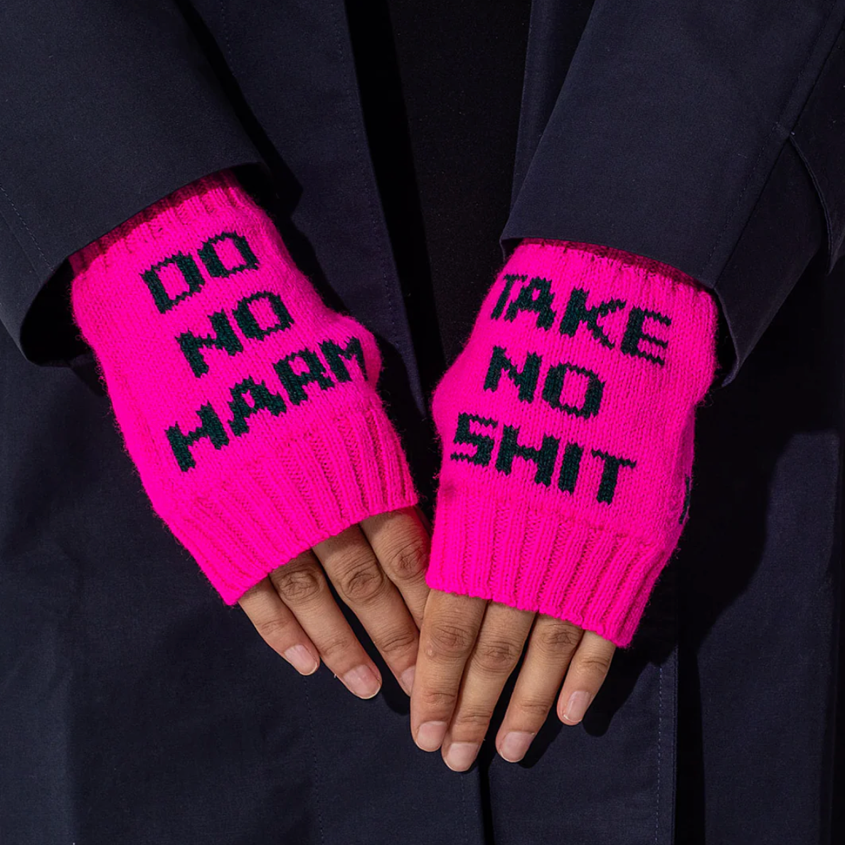 Do No Harm Take No Shit Wrist Warmers in Fluro Pink