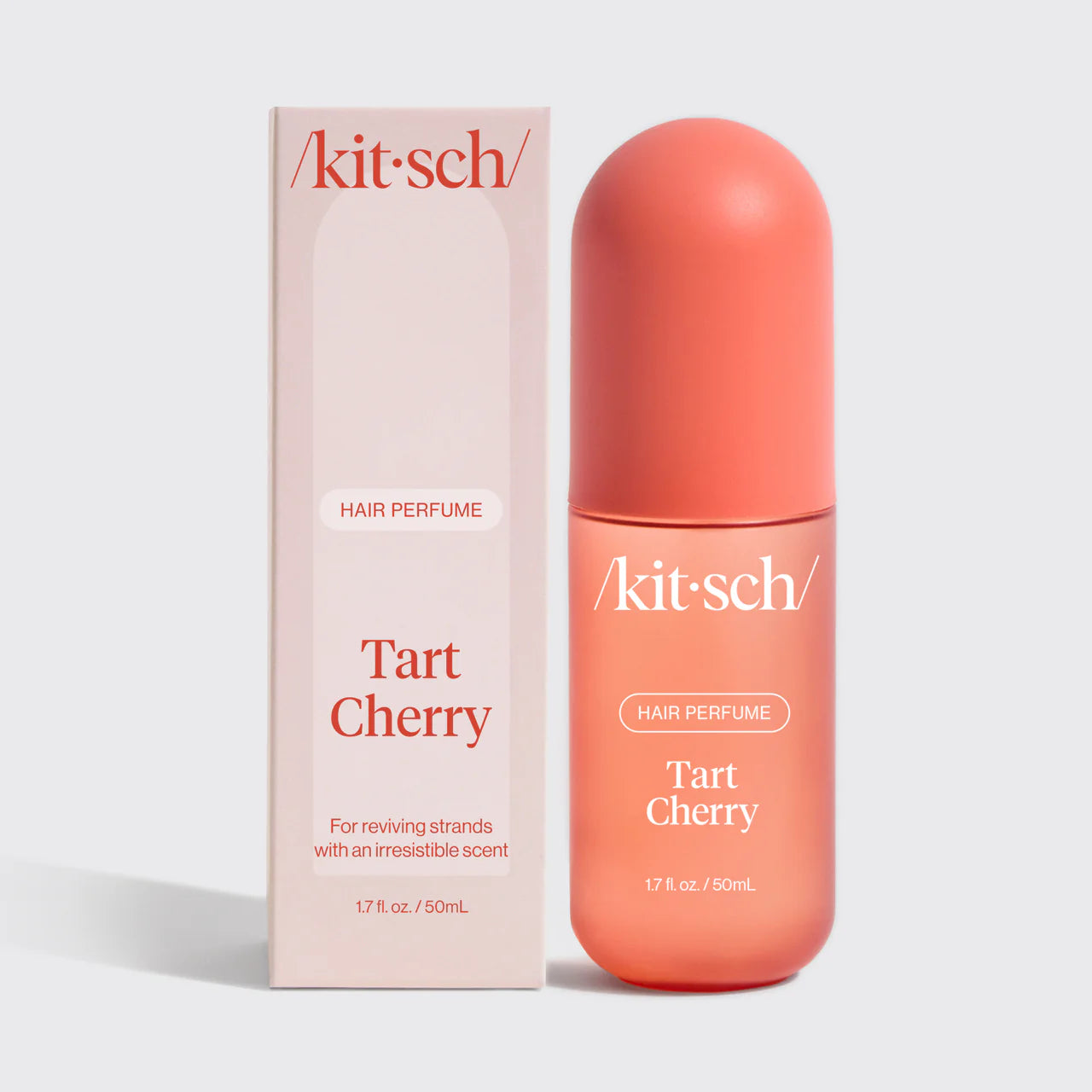 Kit-sch Tart Cherry hair perfume bottle and packaging on a light gray background