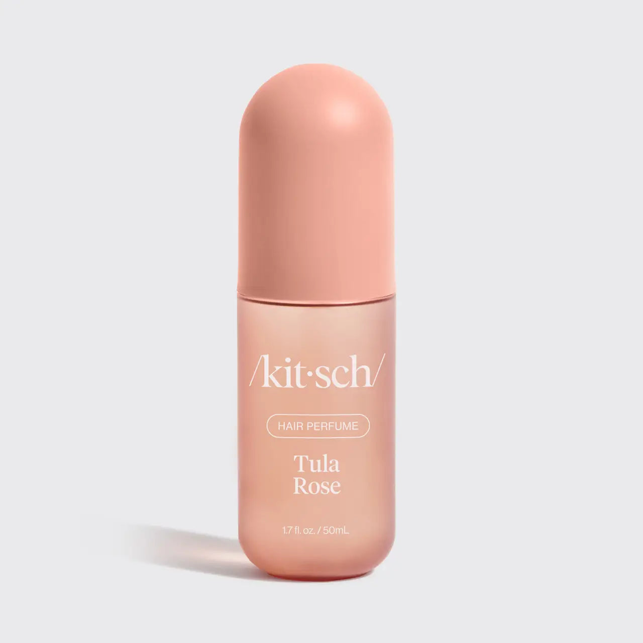 Kit-sch Tula Rose hair perfume bottle on a light gray background
