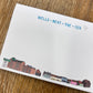 Note card with 'Wells-next-the-Sea' illustration on a wooden surface