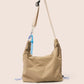 Gandys taupe shoulder bag with a strap on a beige background