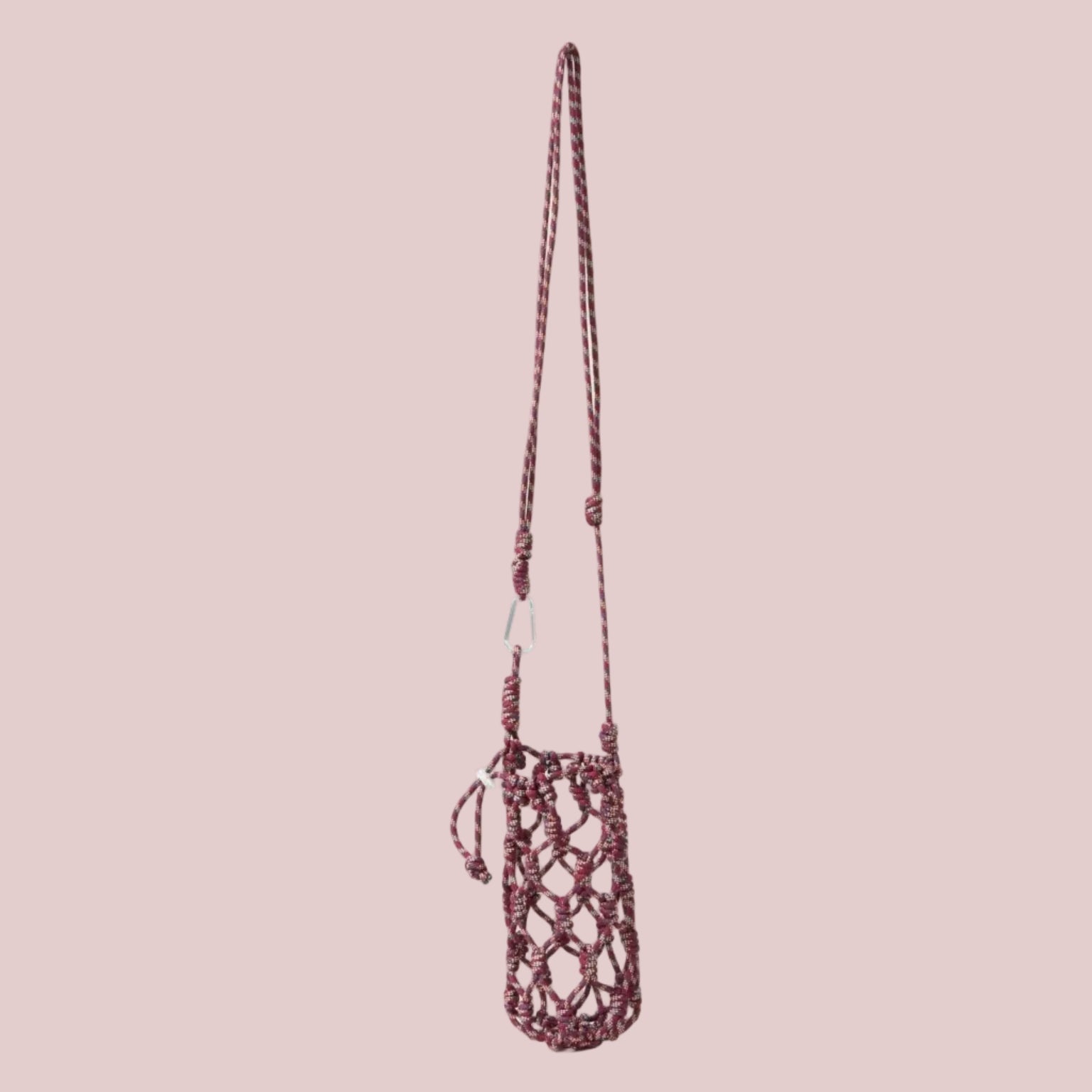 Net DRINKS bag with a long strap on a beige background
