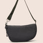 Black shoulder bag on a beige background