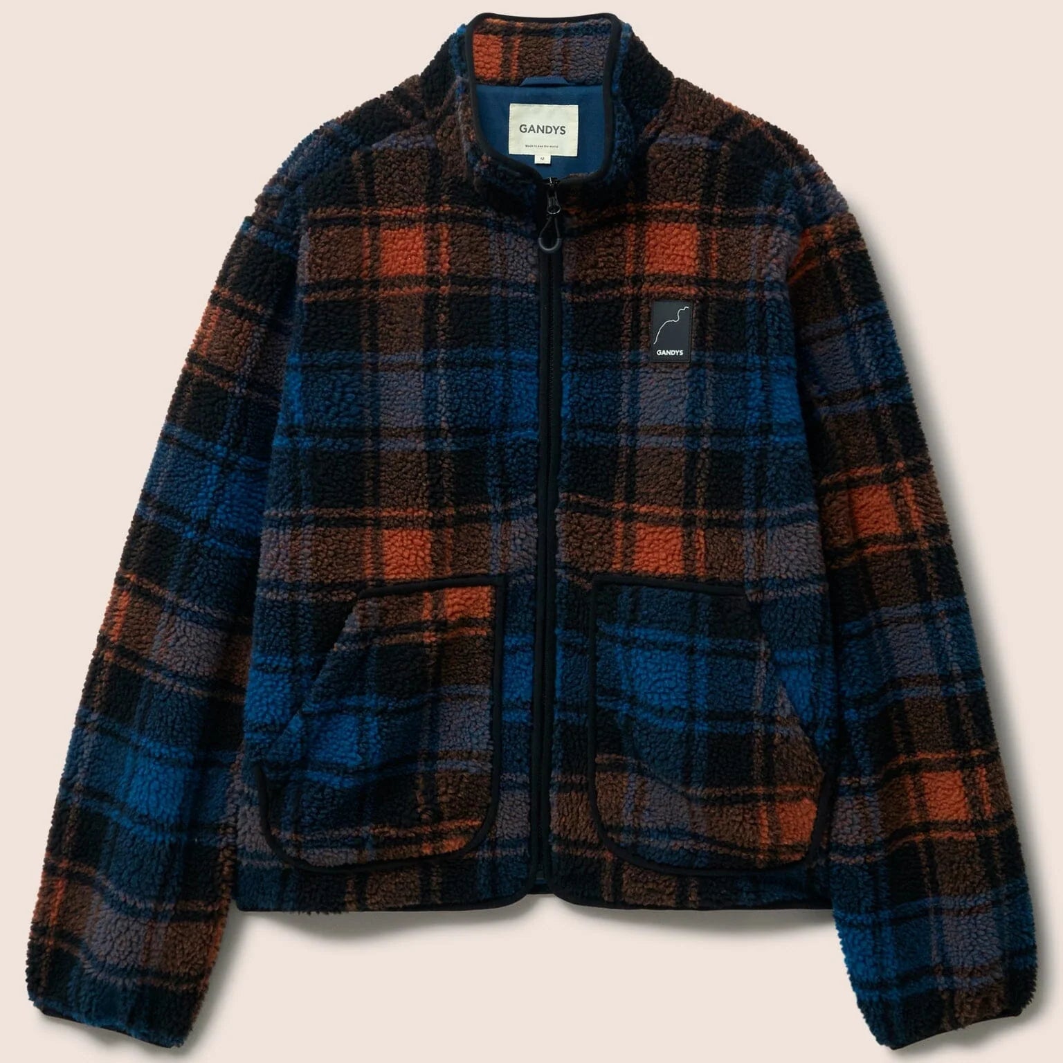 Gandys Plaid jacket with blue, red, and brown colors on a beige background