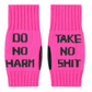 Pink fingerless gloves with black 'do no harm take no shit' text on a white background