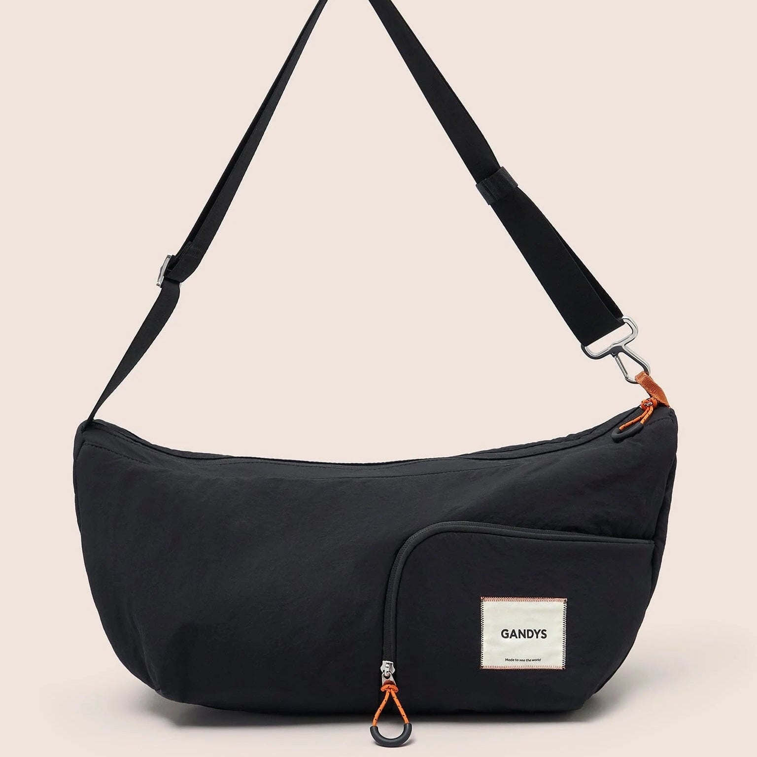 Gandys Black shoulder bag with a visible brand label on a beige background