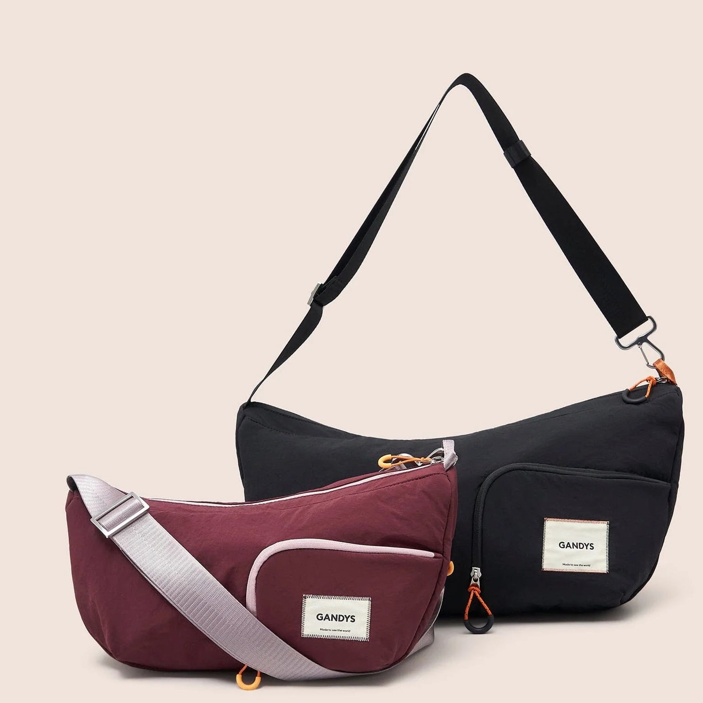 Two bags, one purple and one black, with visible brand labels on a beige background.