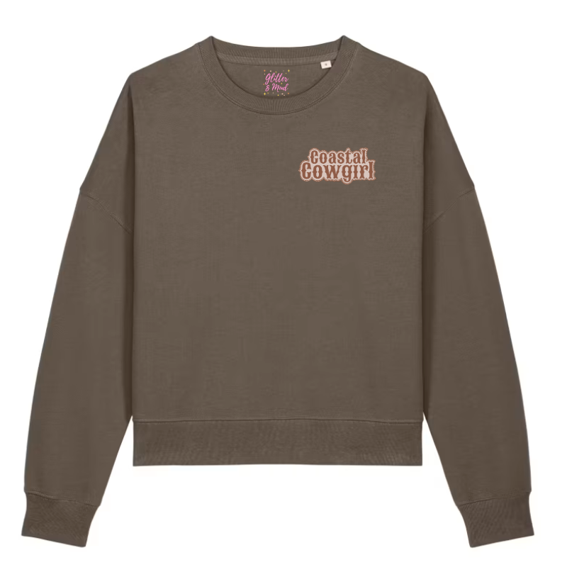 front of brown sweatshirt with western style 'Coastal Cowgirl' text on the right side on a white background