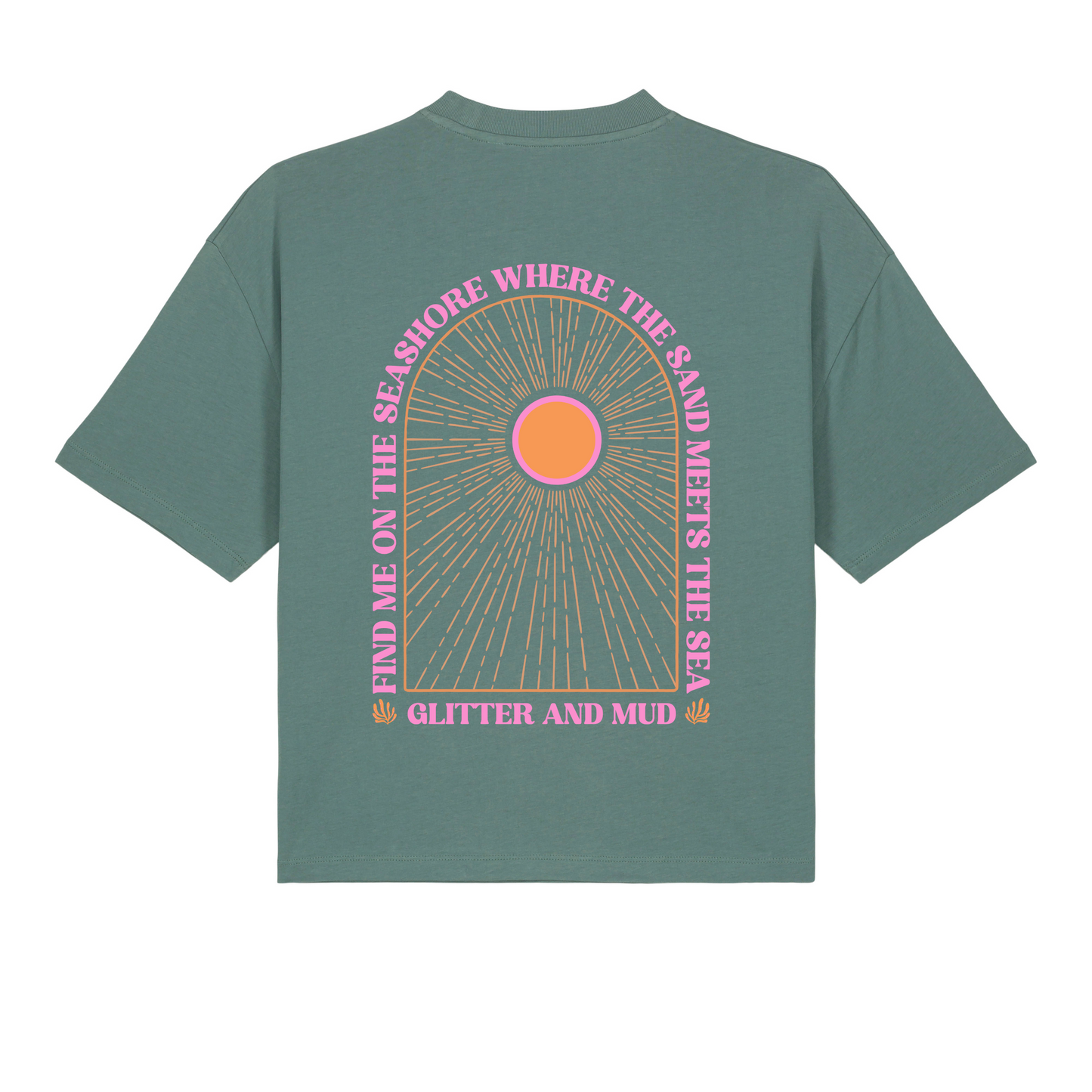 A green women's T-shirt with a graphic arch design featuring the text 'Find me on the seashore where the sand meets the sea, glitter and mud' and a pink sun motif.