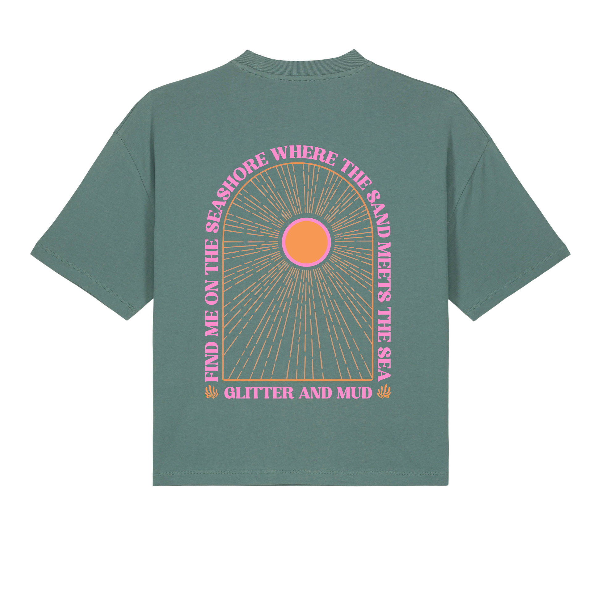 A green women's T-shirt with a graphic arch design featuring the text 'Find me on the seashore where the sand meets the sea, glitter and mud' and a pink sun motif.