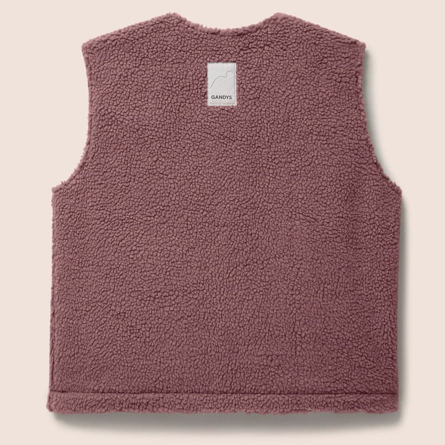 Gandys womens pink fleece vest on a beige background