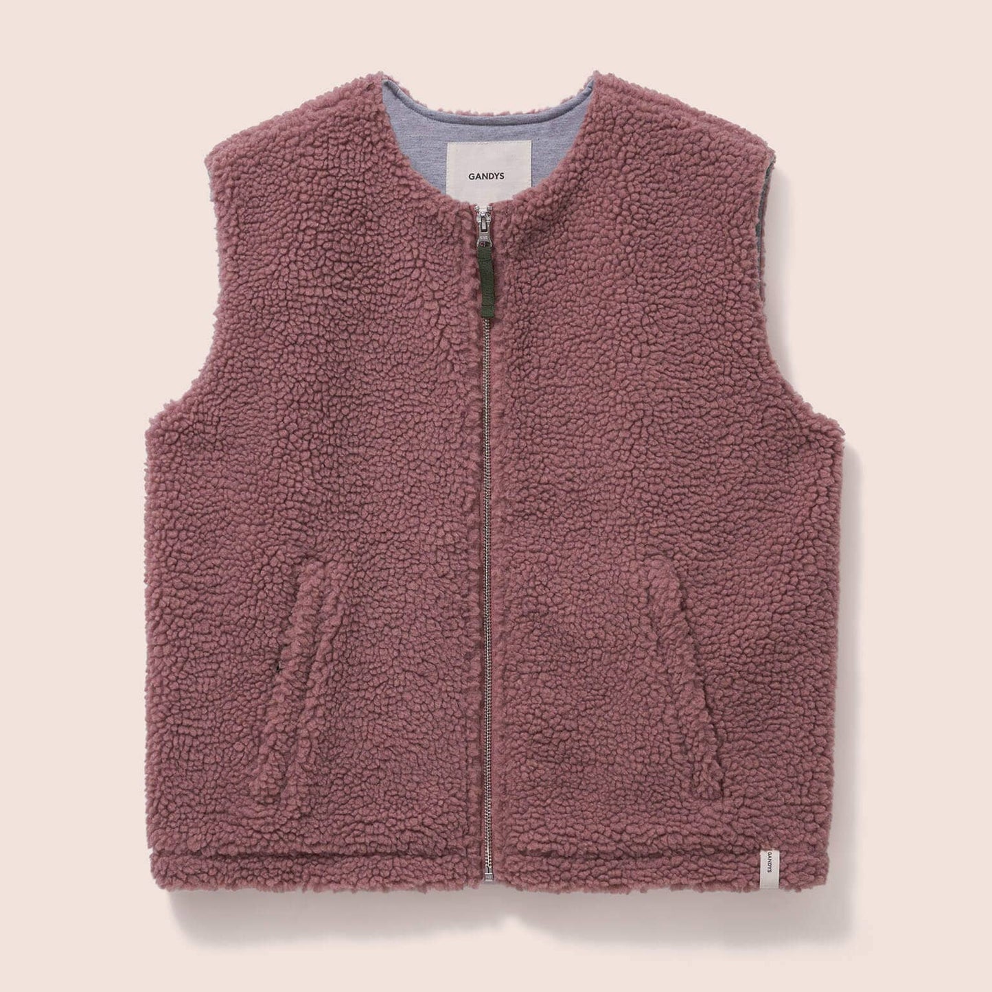 Gandys womens Pink fleece vest on a beige background