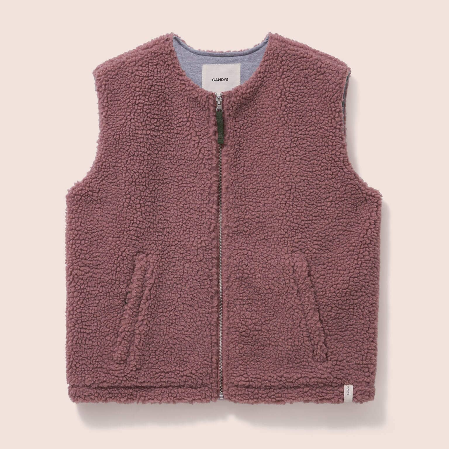 Gandys womens Pink fleece vest on a beige background