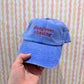 harry styles hangonver chasing blue cap with red text