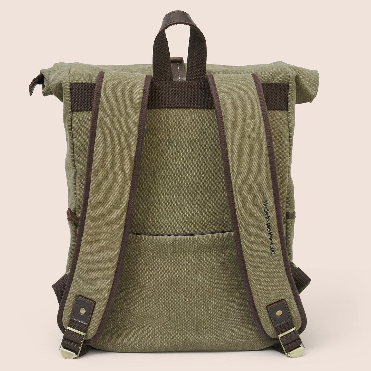 Gandys green roll-top backpack with brown straps on a beige background