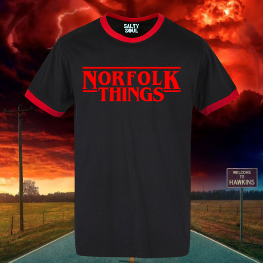 Black ringer  t-shirt with 'Norfolk Things' in red text in stranger things style against a dramatic sky background