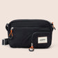 Black waist bag with orange zippers and 'GANDYS' brand label on a beige background