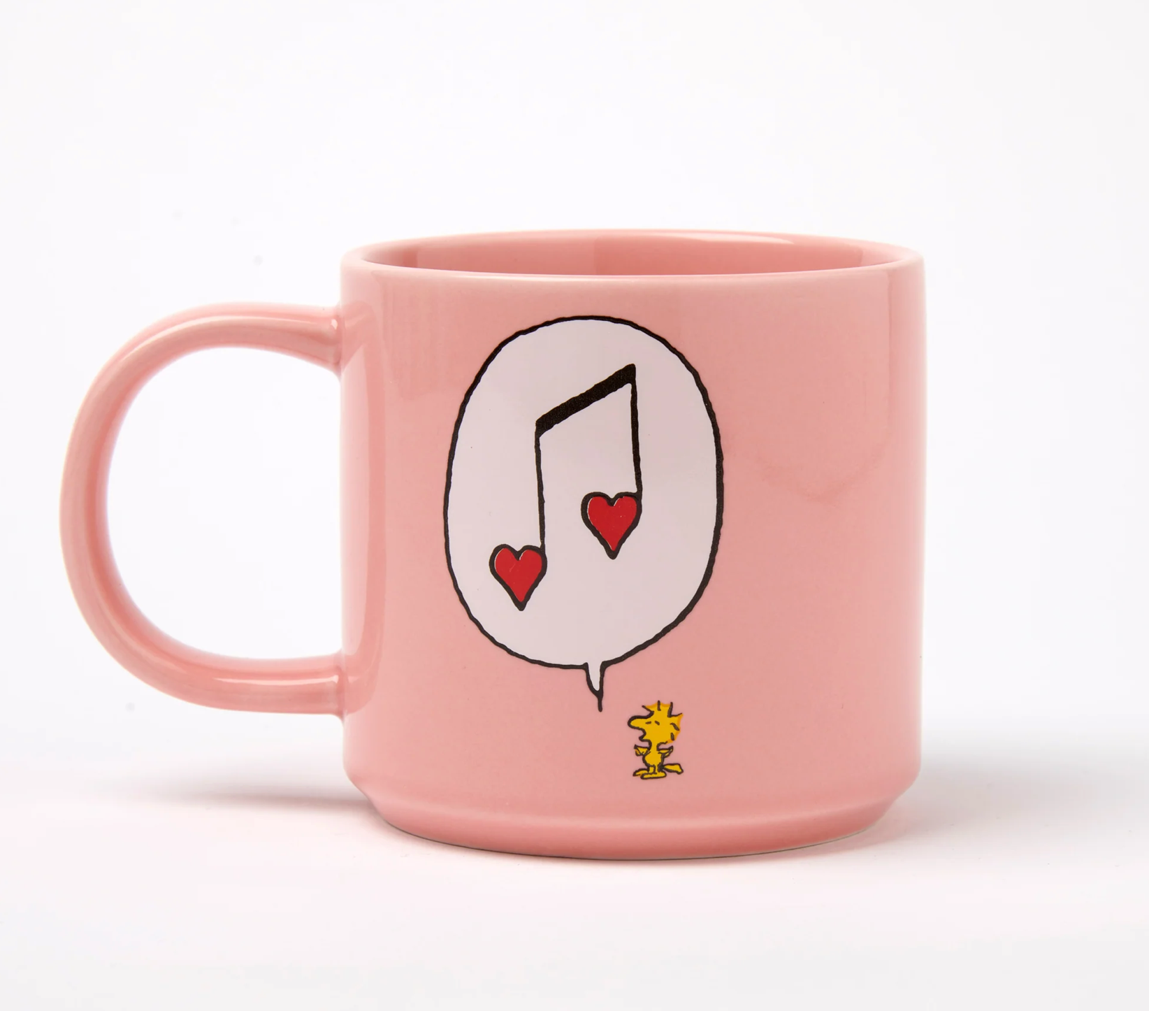 pastel Pink mug with a musical note and heart design in a speach bubble from woodstock on a white background