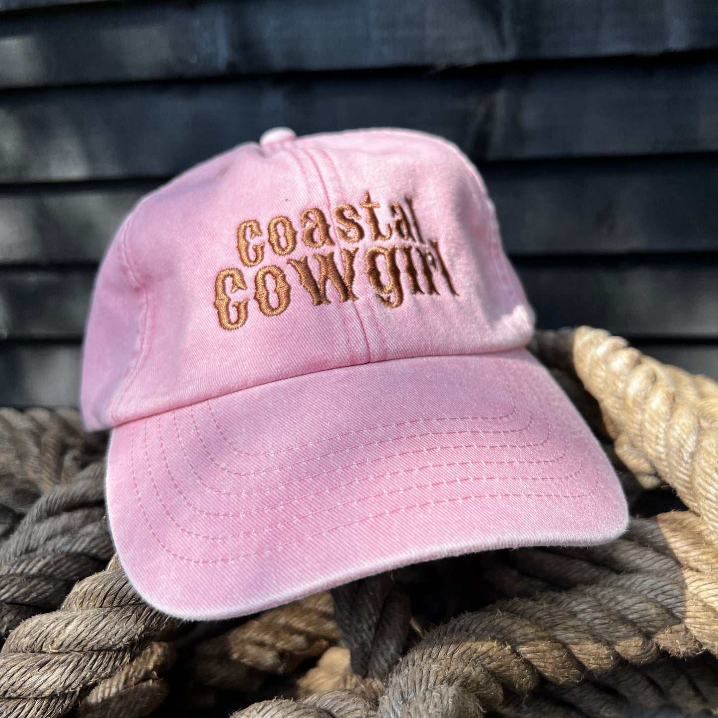pink embroidered 'coastal cowgirl' dad cap on rope 