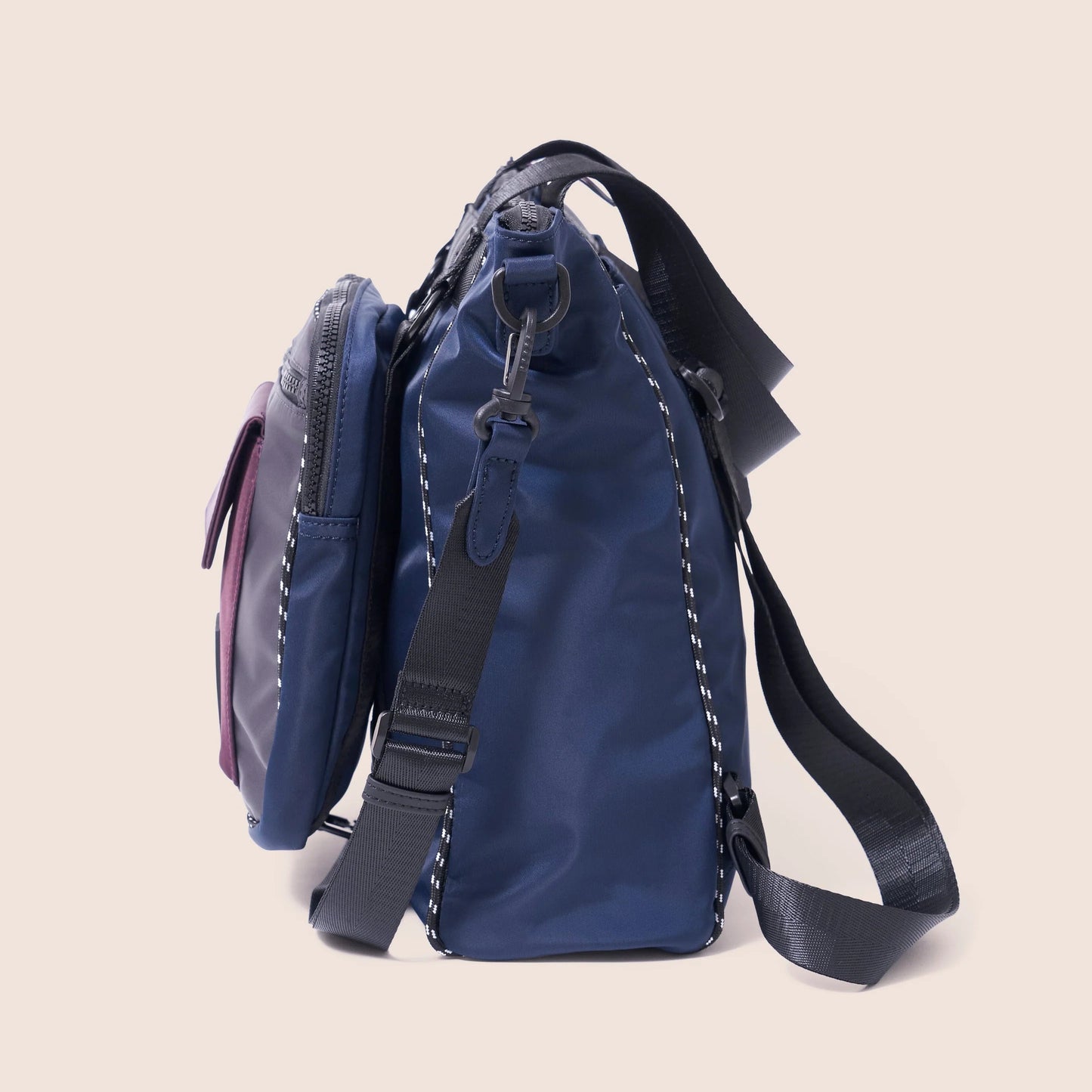 Blue backpack with a strap on a beige background