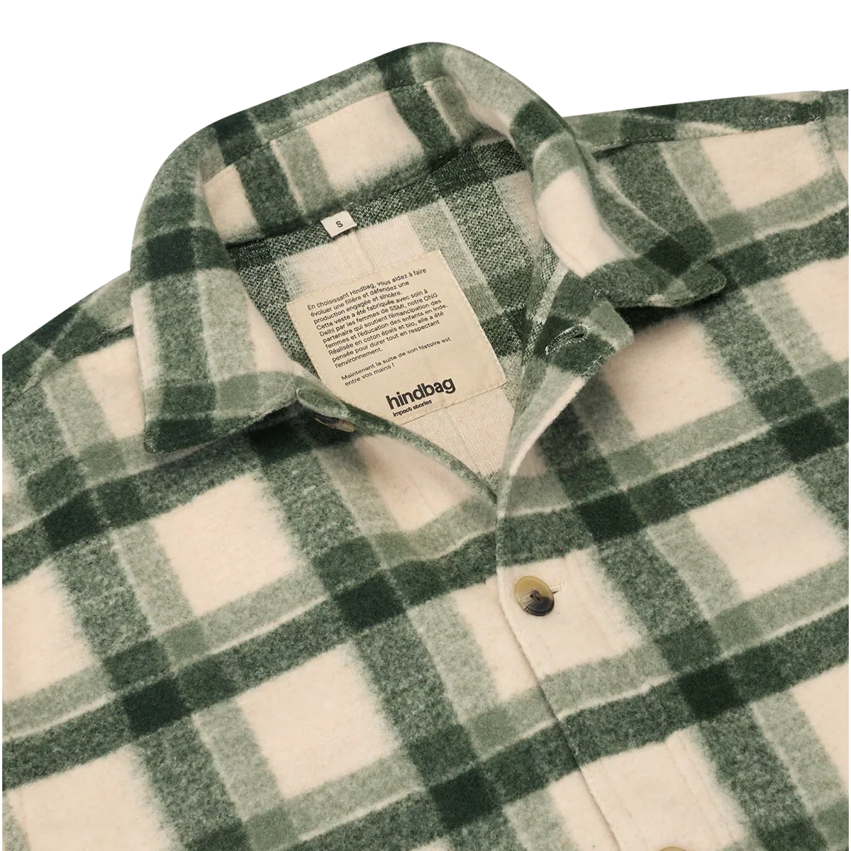 A close-up of a green and cream plaid fleece button-up shirt by Hindbag, showing the collar, inner neck label, and front buttons.