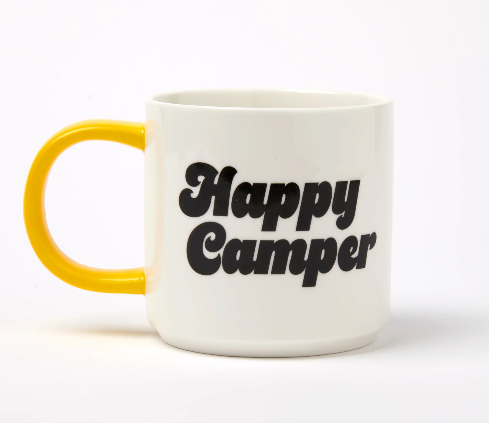 white Mug with 'Happy Camper' in black text and yellow handle on a white background