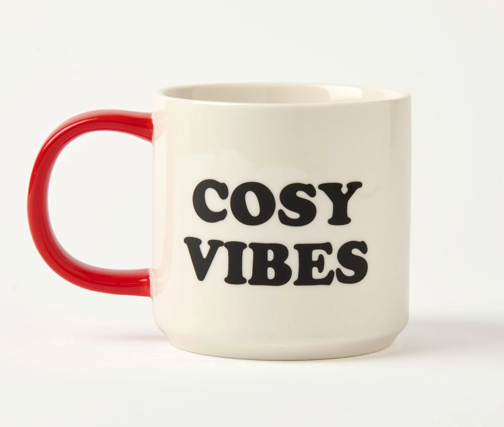 white mug with red handle and  'Cosy Vibes' black text on a white background