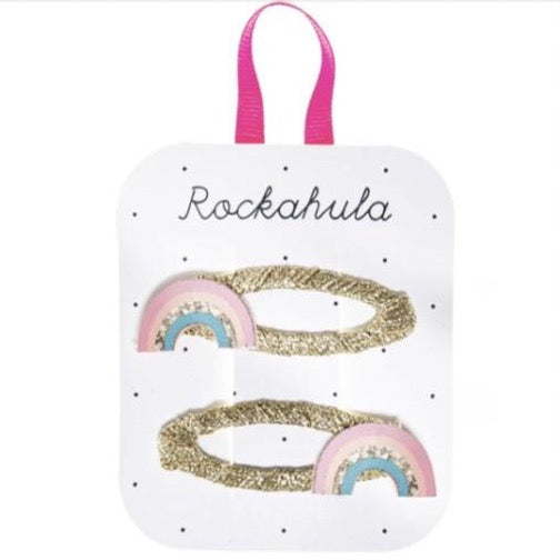 Rockahula hair clips.Wear a little bit of happiness in your hair! Our dreamy rainbows are created from the softest colour palette with a hint of sparkling gold, and are set on gold wrapped snap clips. 