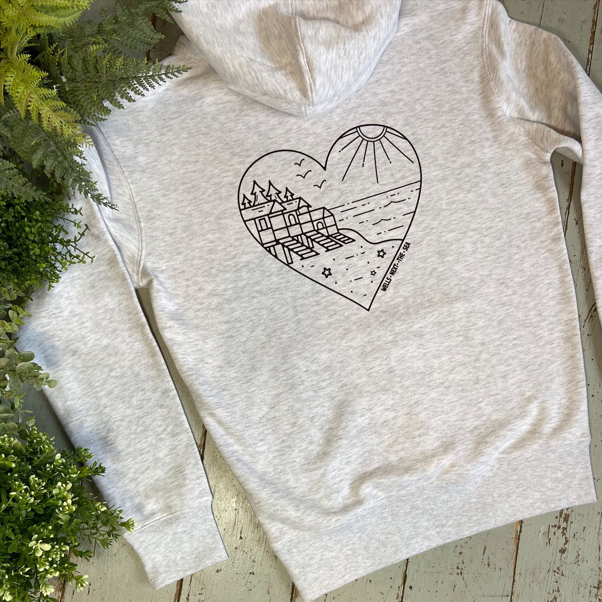 Wells next the sea, Norfolk Hoodie shows our love of our fabulous beach huts on a unisex organic hoodie. Glitter & Mud