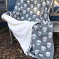 Snuggle up under one of our gorgeous skull design  fleecy-backed throws. Perfect for TV watching on the sofa, a great addition to bedrooms and just the thing for outdoor evenings on the terrace. Glitter & Mud